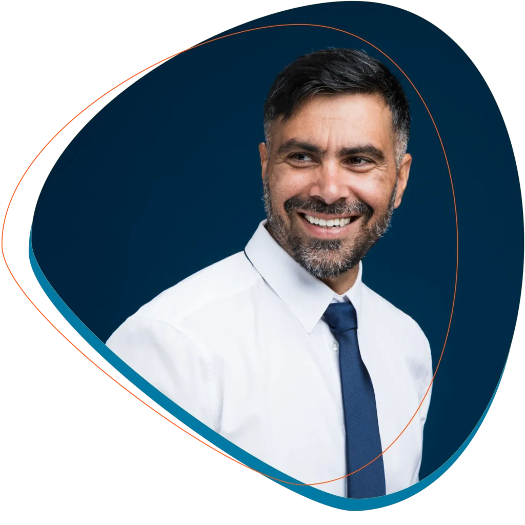 Man in white shirt and blue tie looking just left of camera